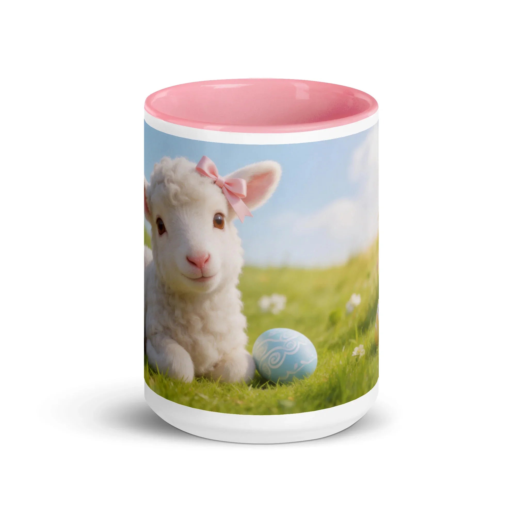 White ceramic mug with pink interior, featuring a lamb with a pink bow and an Easter egg on grass