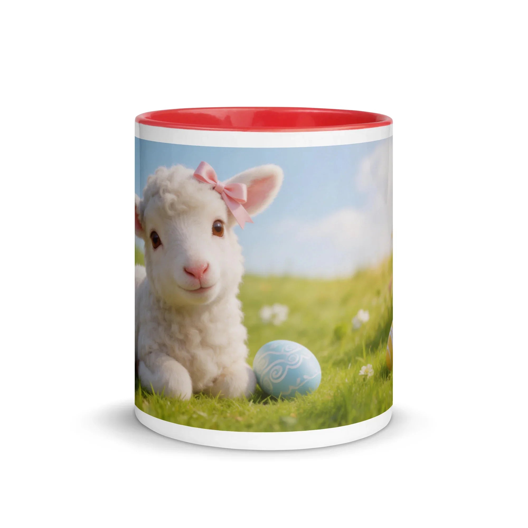 White ceramic mug with red interior featuring a lamb with a pink bow and Easter egg on grass