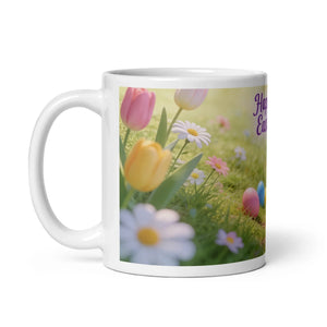 White ceramic mug with spring flowers, Easter eggs, and 'Happy Easter' text, handle on left