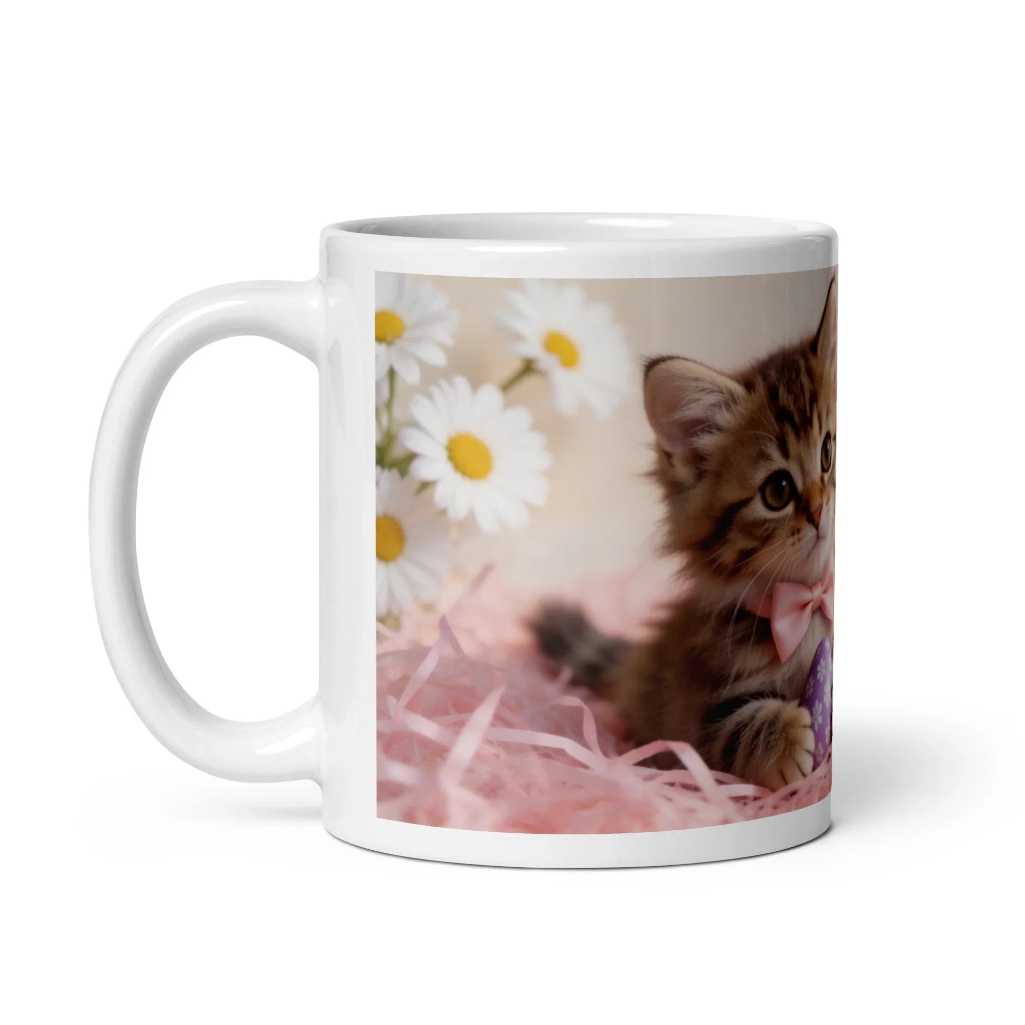 White glossy ceramic mug with a photo of a kitten, daisies, and pastel decor, handle on left