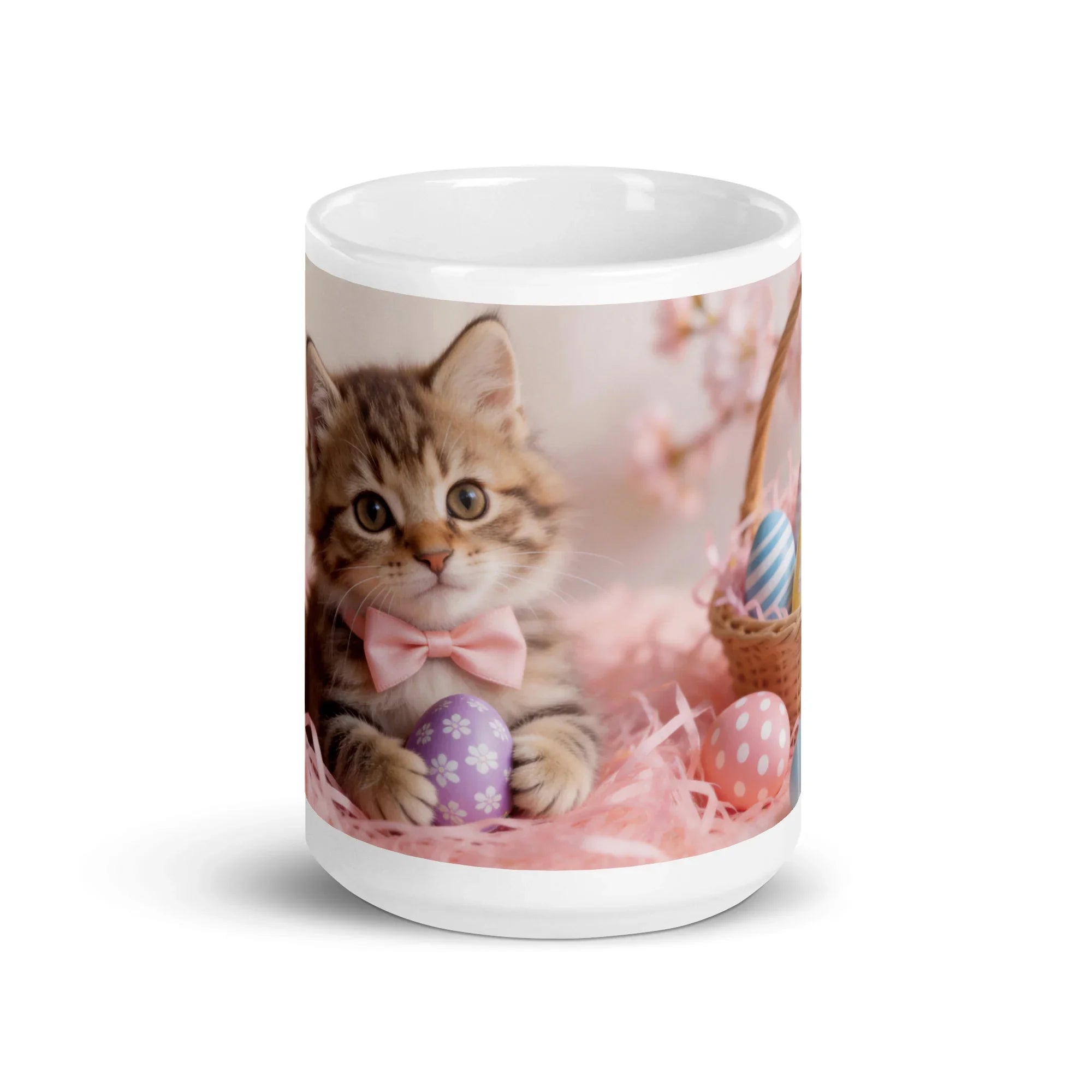 White glossy mug with cute kitten in pink bowtie, Easter eggs, and spring basket design