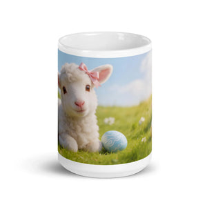White glossy mug with a cute lamb wearing a pink bow and a decorated blue egg in a grassy field