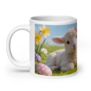 White glossy mug featuring a cute lamb, Easter eggs, and spring flowers on green grass