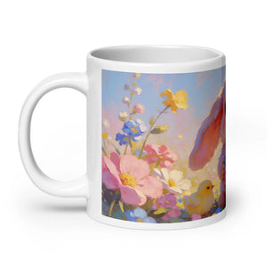 White ceramic mug featuring pastel spring flowers, a bunny ear, and a yellow chick illustration